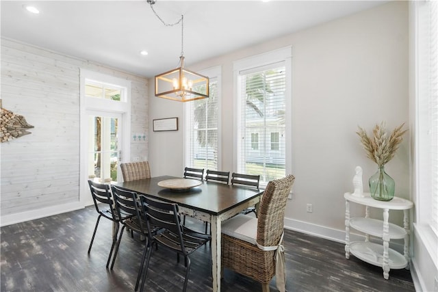 125 Fish Hook Ln, Port Aransas, TX 78373 - dining room with baseboards, dark wood-type flooring, and plenty of natural light