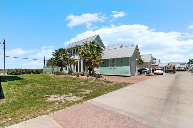 125 Fish Hook Ln, Port Aransas, TX 78373 - coastal home with a front lawn and metal roof