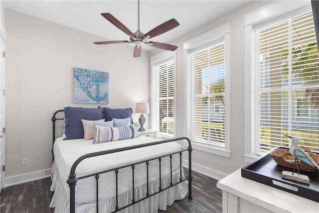 125 Fish Hook Ln, Port Aransas, TX 78373 - bedroom with a ceiling fan, baseboards, and dark wood-style flooring