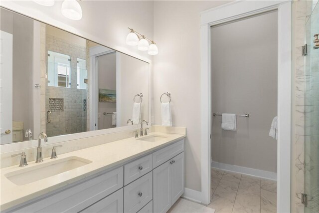 125 Fish Hook Ln, Port Aransas, TX 78373 - full bathroom featuring a shower stall, marble finish floor, baseboards, and a sink