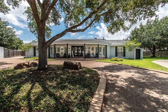 view of front of house featuring a front lawn and a porch