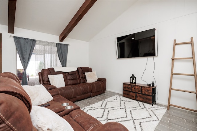 living room with lofted ceiling with beams and light hardwood / wood-style flooring