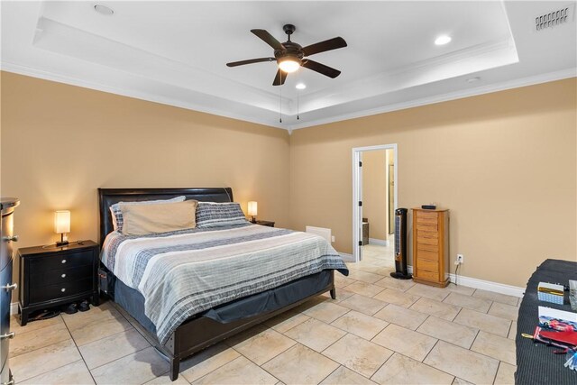 bedroom featuring a tray ceiling, light tile patterned floors, visible vents, ornamental molding, and baseboards