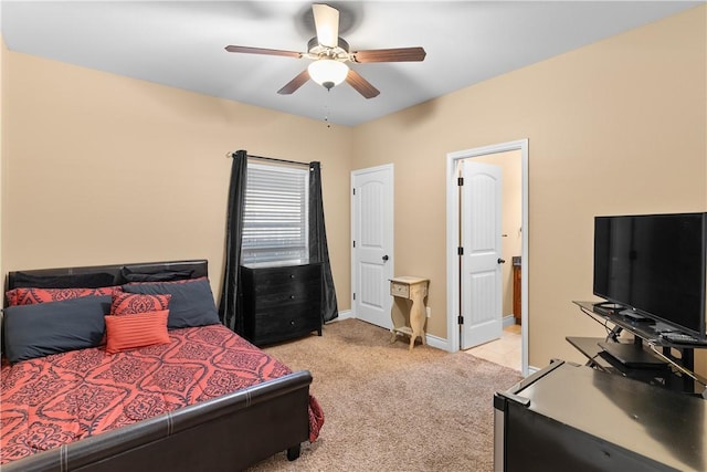 bedroom featuring ceiling fan, baseboards, and light colored carpet