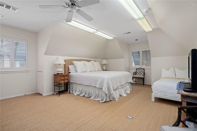 bedroom featuring ceiling fan, light colored carpet, and lofted ceiling