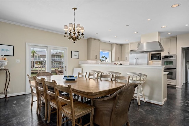 dining area featuring crown molding, plenty of natural light, and a chandelier