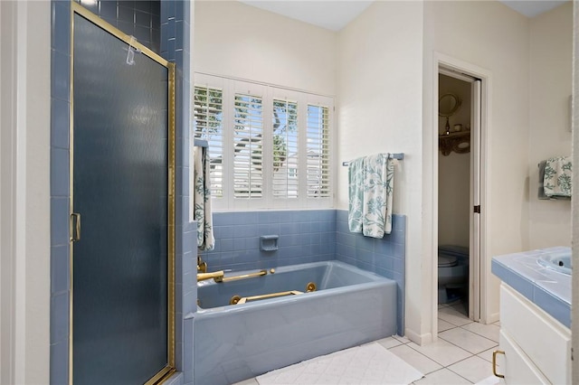 full bathroom with vanity, tile patterned floors, shower with separate bathtub, and toilet