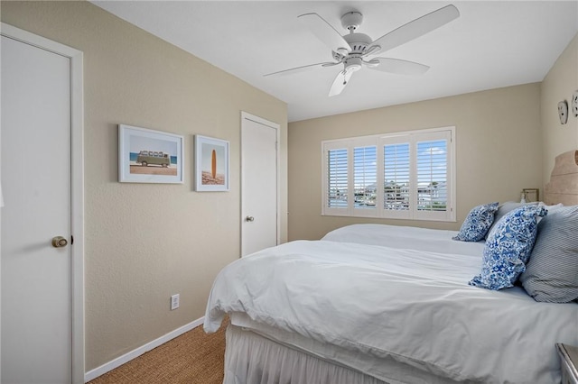 bedroom with ceiling fan and carpet