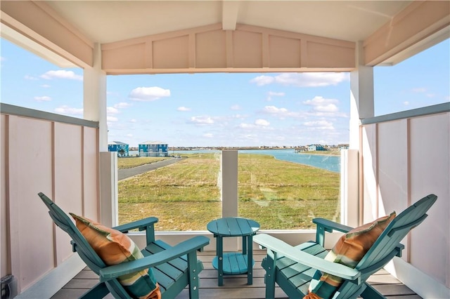 balcony featuring a water view
