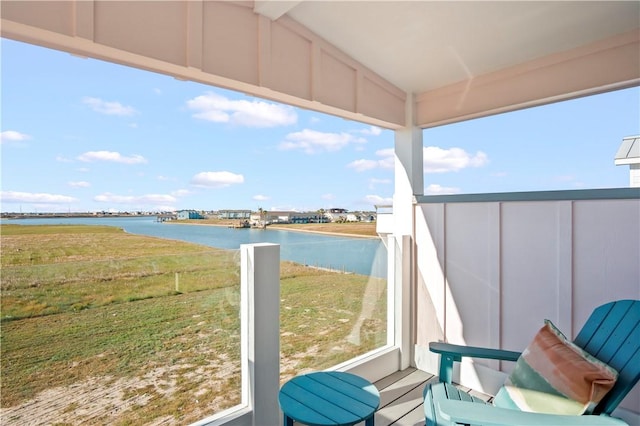 balcony featuring a water view