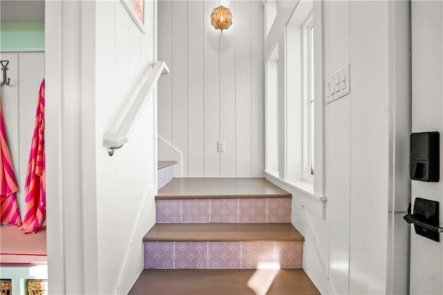 staircase featuring wood finished floors