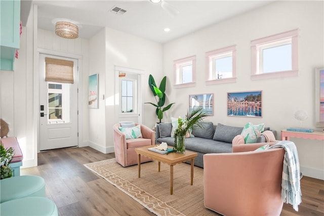 sitting room featuring baseboards, visible vents, wood finished floors, and recessed lighting