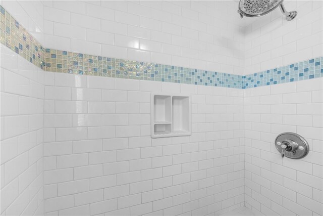 bathroom with tiled shower