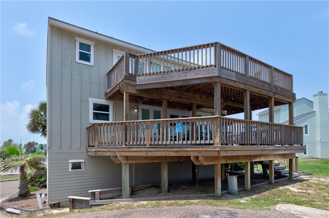 back of house with a wooden deck