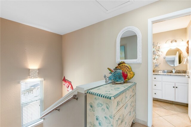 interior space featuring vanity and tile patterned floors