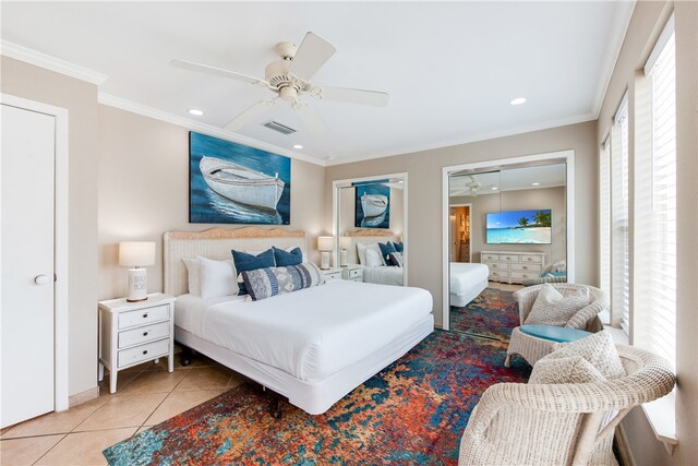 tiled bedroom featuring ceiling fan and ornamental molding