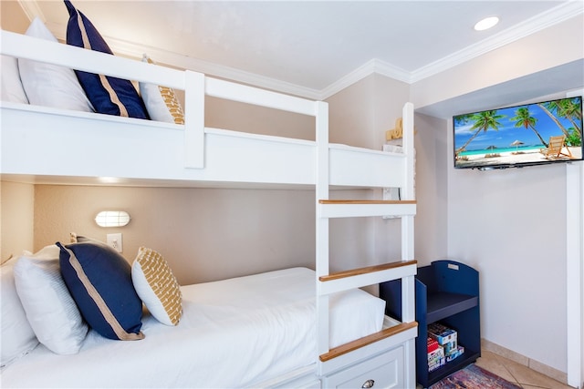 bedroom with tile patterned flooring and crown molding