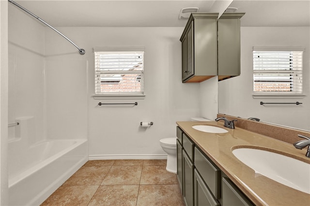 full bathroom featuring vanity, tile patterned floors, toilet, and shower / bathtub combination