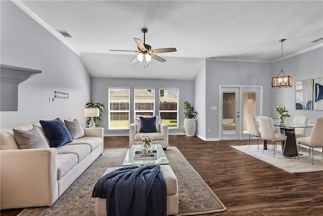 living room featuring ceiling fan with notable chandelier, lofted ceiling, hardwood / wood-style flooring, and crown molding