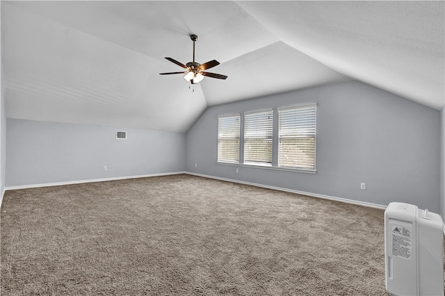 additional living space with ceiling fan, vaulted ceiling, and carpet floors