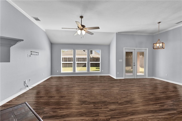 unfurnished living room with dark hardwood / wood-style flooring, vaulted ceiling, ornamental molding, and ceiling fan with notable chandelier