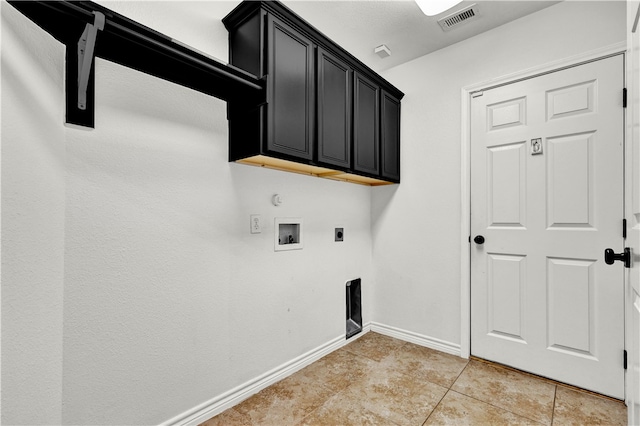 laundry area with cabinets, electric dryer hookup, hookup for a washing machine, and light tile patterned floors