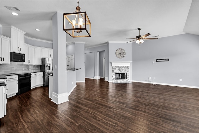 kitchen with ceiling fan with notable chandelier, black appliances, dark hardwood / wood-style floors, white cabinetry, and a fireplace