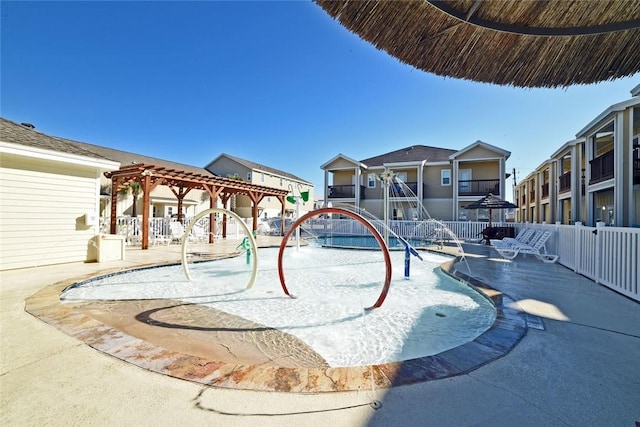 view of swimming pool featuring a pergola