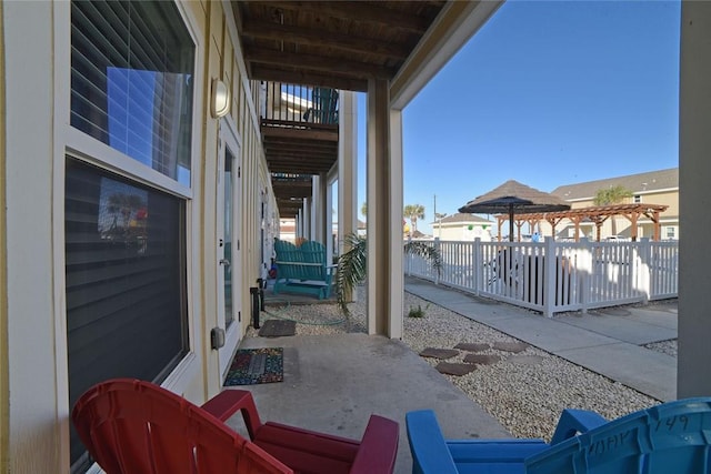 view of patio / terrace with a pergola and fence