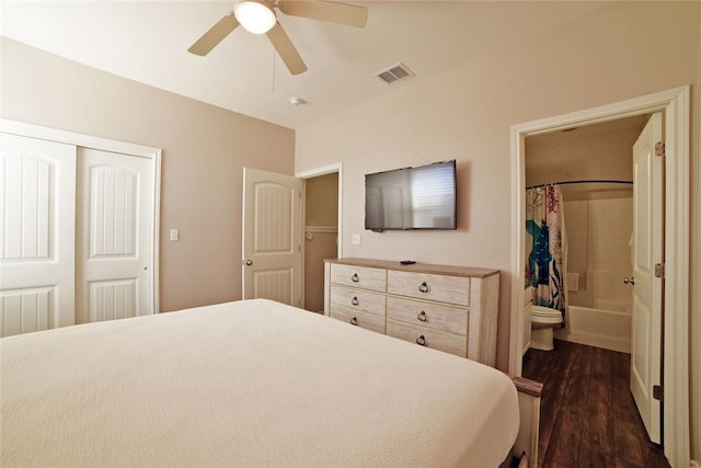 bedroom featuring a closet, visible vents, dark wood finished floors, and ceiling fan