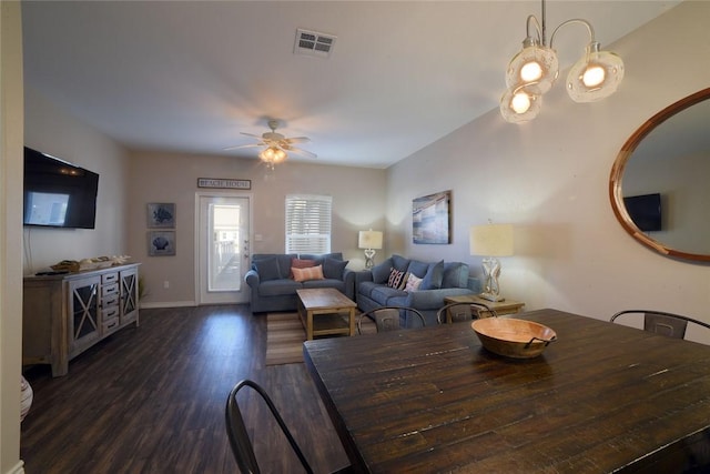 dining area featuring dark wood finished floors, a ceiling fan, visible vents, and baseboards
