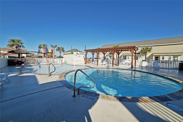 pool featuring playground community, a patio area, fence, and a pergola