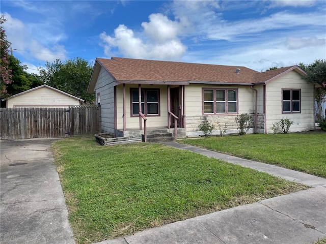 4706 Mable St, Corpus Christi, TX 78411 - ranch-style home with a shingled roof, concrete driveway, covered porch, and stone siding