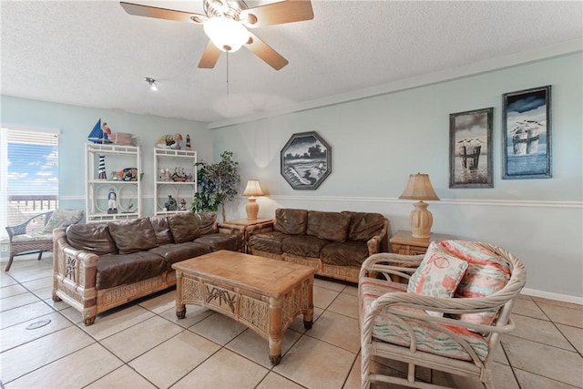 living room with light tile patterned floors, a textured ceiling, and ceiling fan