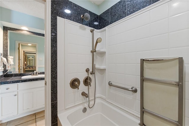 bathroom with tile patterned floors, vanity, and shower / bathing tub combination