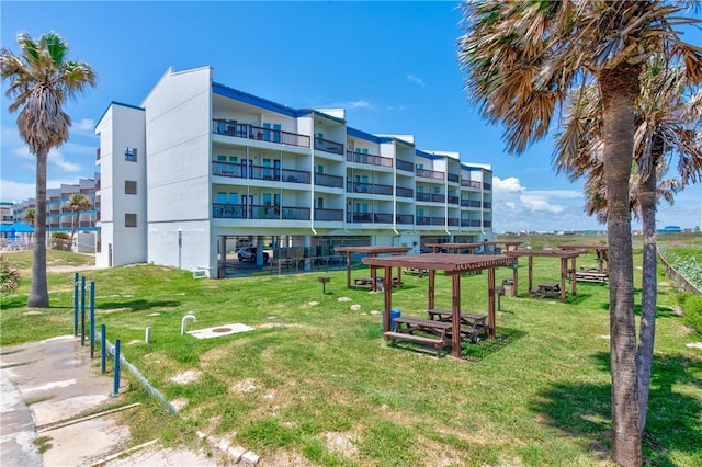 view of home's community featuring a lawn