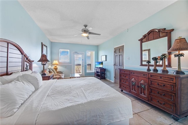 bedroom with light tile patterned floors, a textured ceiling, ceiling fan, and access to outside