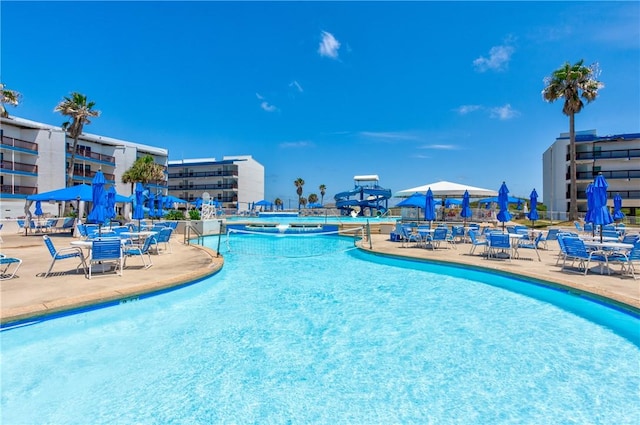 view of swimming pool featuring a patio