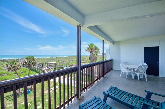 balcony featuring a water view