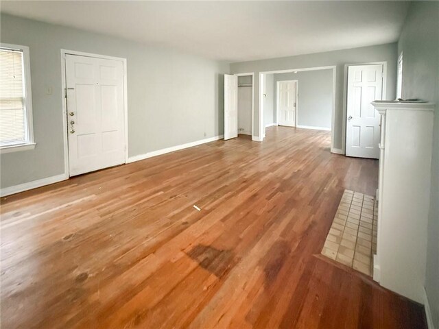 250 Rosebud Ave, Corpus Christi, TX 78404 - unfurnished living room featuring wood finished floors and baseboards