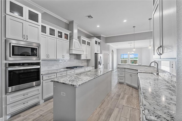 4229 Midlands St, Corpus Christi, TX 78414 - kitchen featuring appliances with stainless steel finishes, crown molding, a sink, decorative backsplash, and recessed lighting