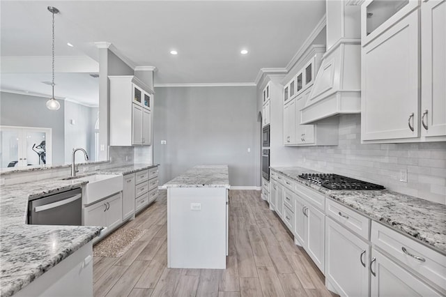 4229 Midlands St, Corpus Christi, TX 78414 - kitchen featuring stainless steel appliances, crown molding, a sink, white cabinetry, and recessed lighting