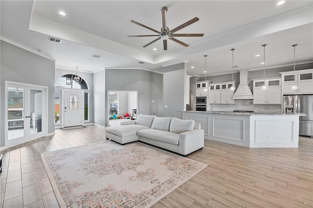 4229 Midlands St, Corpus Christi, TX 78414 - living area with a raised ceiling, light wood-style floors, a ceiling fan, ornamental molding, and recessed lighting