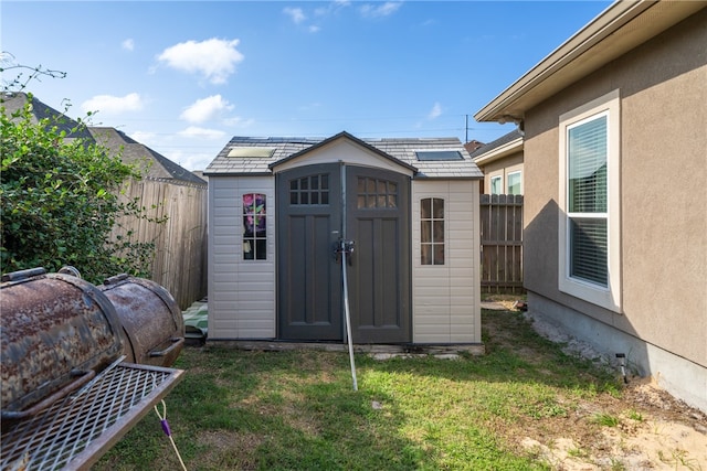 view of outbuilding featuring a lawn