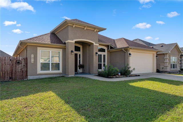 view of front of house with a garage and a front yard