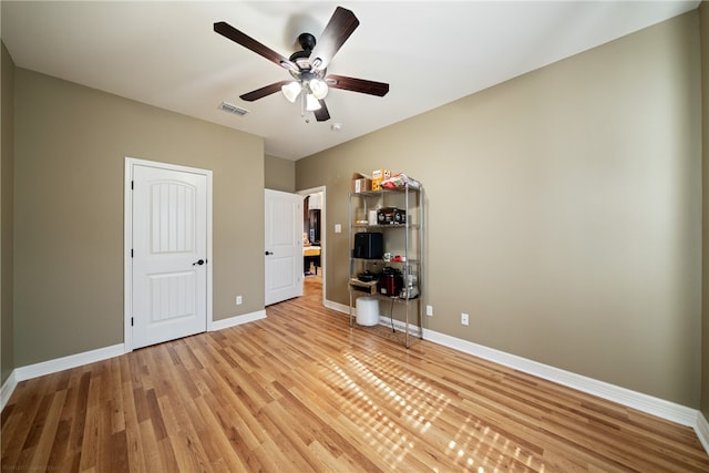 unfurnished bedroom featuring ceiling fan and light hardwood / wood-style flooring