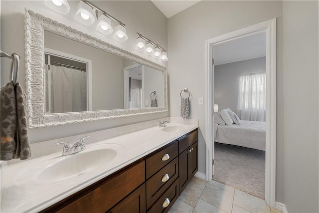 bathroom featuring tile patterned flooring and vanity