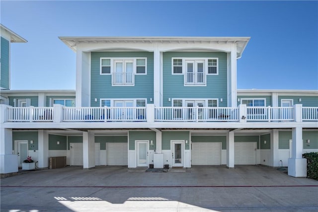 rear view of property featuring a garage