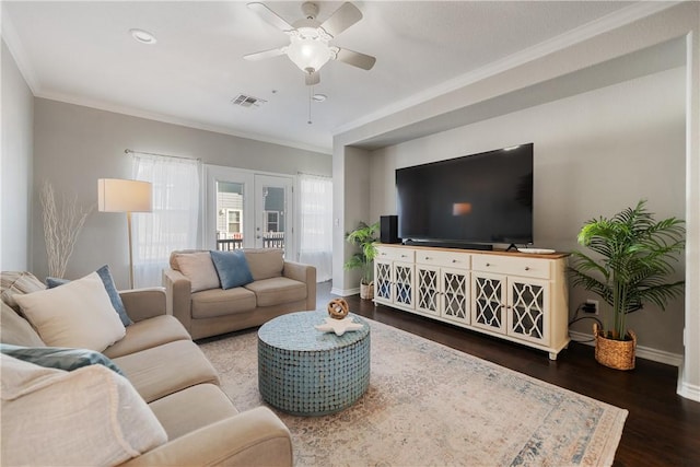 living room featuring dark hardwood / wood-style floors, ceiling fan, ornamental molding, and french doors