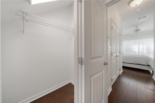 hallway featuring dark hardwood / wood-style flooring